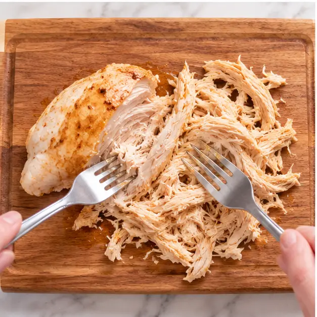 Step 3: Shredding cooked chicken fillet with two forks
