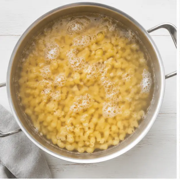 Step 1: Boiling elbow macaroni in salted water