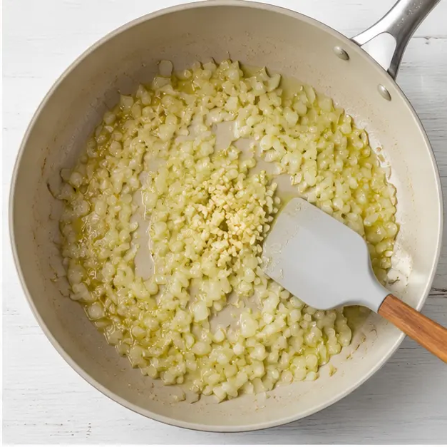 Step 2: Sautéing onion and garlic in olive oil