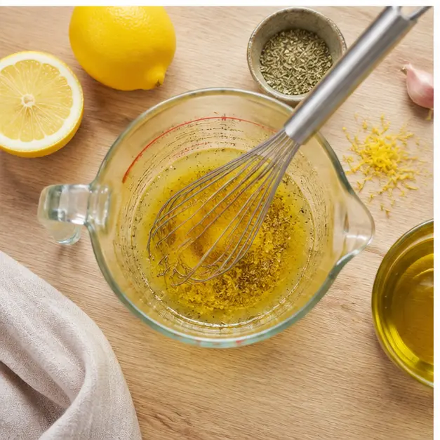 Step 3: Whisking the Meyer lemon vinaigrette until emulsified